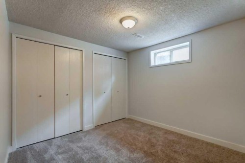 48 Hillary Crescent Sw, Calgary, AB - Indoor Photo Showing Other Room