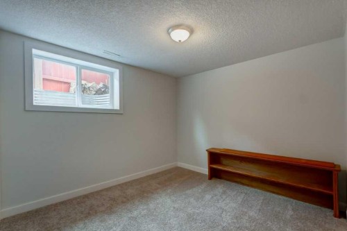 48 Hillary Crescent Sw, Calgary, AB - Indoor Photo Showing Other Room