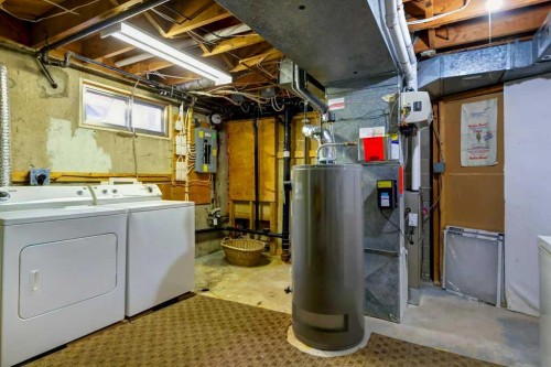48 Hillary Crescent Sw, Calgary, AB - Indoor Photo Showing Laundry Room
