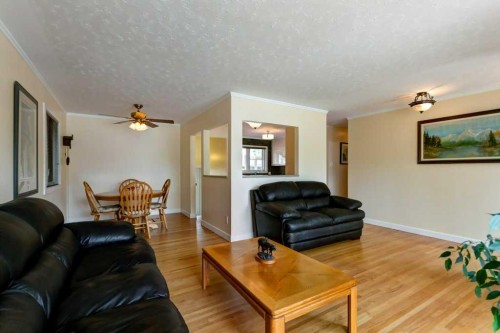 48 Hillary Crescent Sw, Calgary, AB - Indoor Photo Showing Living Room