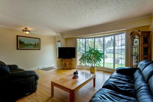 48 Hillary Crescent Sw, Calgary, AB - Indoor Photo Showing Living Room