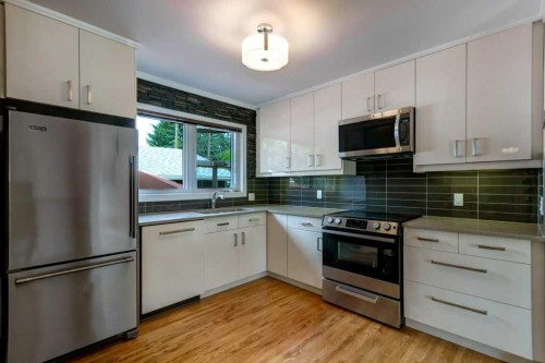48 Hillary Crescent Sw, Calgary, AB - Indoor Photo Showing Kitchen With Upgraded Kitchen