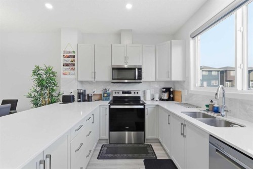 44 Amblefield Avenue Nw, Calgary, AB - Indoor Photo Showing Kitchen With Double Sink
