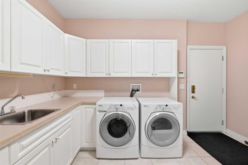 60 Prominence Point Sw, Calgary, AB - Indoor Photo Showing Laundry Room