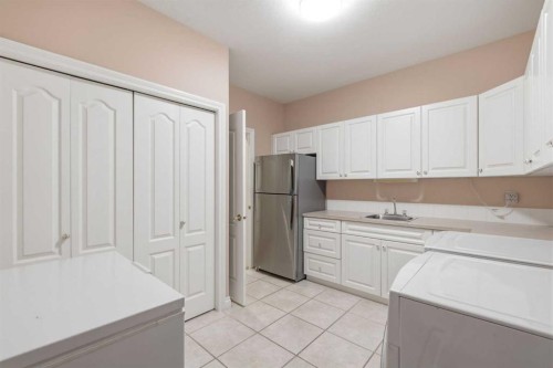 60 Prominence Point Sw, Calgary, AB - Indoor Photo Showing Kitchen