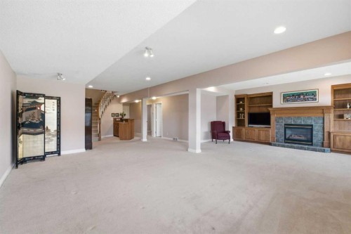 60 Prominence Point Sw, Calgary, AB - Indoor With Fireplace