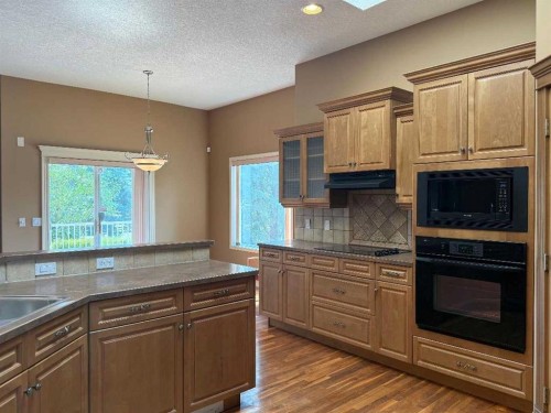 157 Valley Creek Place Nw, Calgary, AB - Indoor Photo Showing Kitchen
