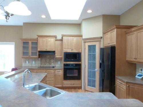 157 Valley Creek Place Nw, Calgary, AB - Indoor Photo Showing Kitchen With Double Sink