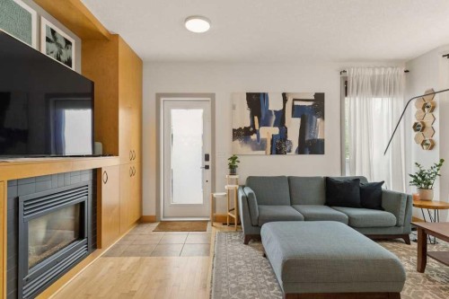 202 26 Avenue Nw, Calgary, AB - Indoor Photo Showing Living Room With Fireplace