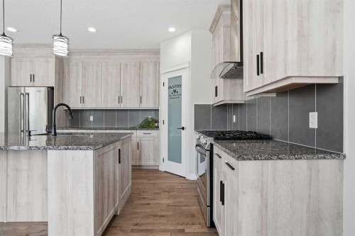 44 Cimarron Springs Circle, Okotoks, AB - Indoor Photo Showing Kitchen With Upgraded Kitchen
