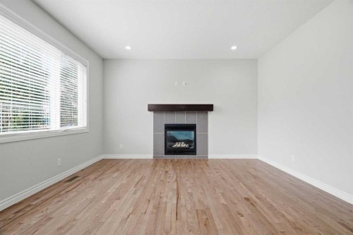 44 Cimarron Springs Circle, Okotoks, AB - Indoor Photo Showing Living Room With Fireplace