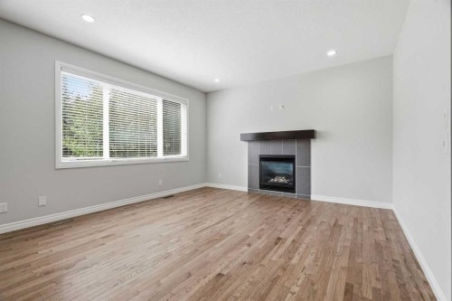 44 Cimarron Springs Circle, Okotoks, AB - Indoor Photo Showing Living Room With Fireplace
