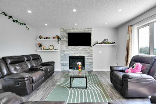 101 Douglas Ridge Circle Se, Calgary, AB - Indoor Photo Showing Living Room With Fireplace