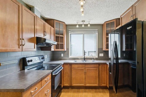 3624 Cedarille Drive Sw, Calgary, AB - Indoor Photo Showing Kitchen With Double Sink