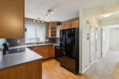 3624 Cedarille Drive Sw, Calgary, AB - Indoor Photo Showing Kitchen With Double Sink