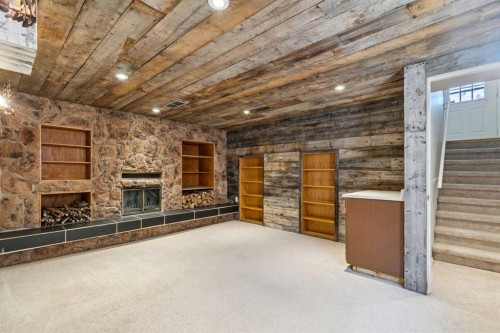 3624 Cedarille Drive Sw, Calgary, AB - Indoor Photo Showing Other Room With Fireplace