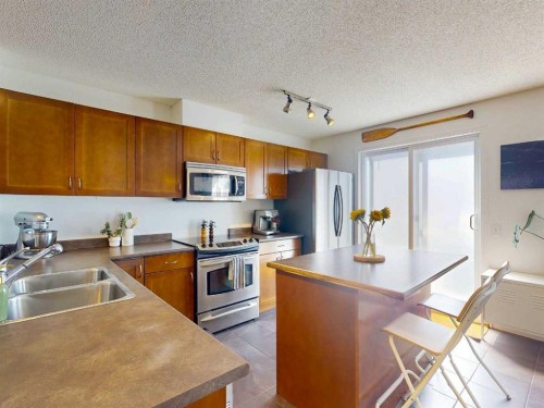 457 Elgin Gardens Se, Calgary, AB - Indoor Photo Showing Kitchen With Double Sink