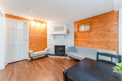 1502 40 Street Se, Calgary, AB - Indoor Photo Showing Living Room With Fireplace