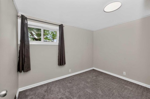 91 Emberdale Way Se, Airdrie, AB - Indoor Photo Showing Other Room