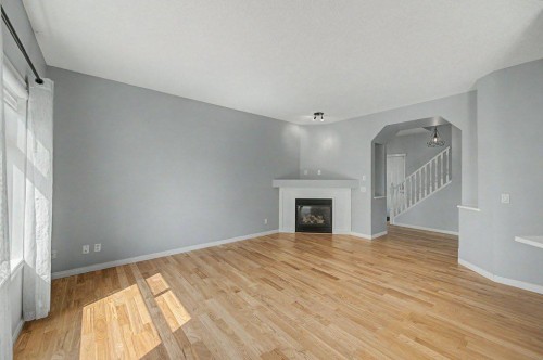 218 Cougarstone Circle Sw, Calgary, AB - Indoor With Fireplace