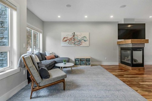 5013 23 Avenue Nw, Calgary, AB - Indoor Photo Showing Living Room With Fireplace