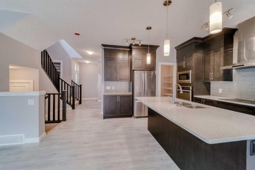 22 Sage Bluff Heights Nw, Calgary, AB - Indoor Photo Showing Kitchen With Double Sink With Upgraded Kitchen