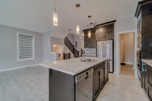 22 Sage Bluff Heights Nw, Calgary, AB - Indoor Photo Showing Kitchen With Double Sink With Upgraded Kitchen