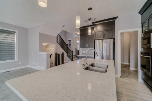 22 Sage Bluff Heights Nw, Calgary, AB - Indoor Photo Showing Kitchen With Double Sink With Upgraded Kitchen