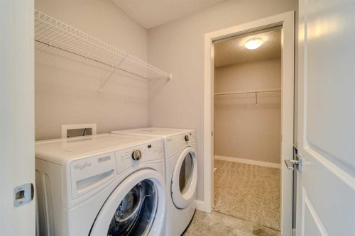 22 Sage Bluff Heights Nw, Calgary, AB - Indoor Photo Showing Laundry Room