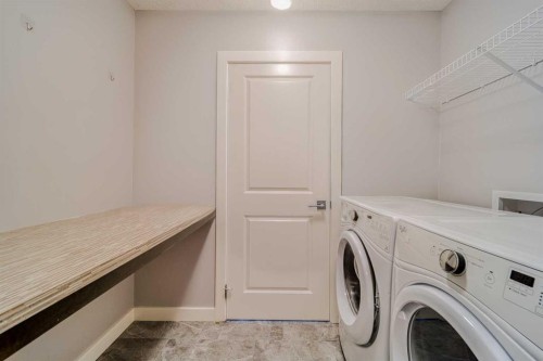 22 Sage Bluff Heights Nw, Calgary, AB - Indoor Photo Showing Laundry Room
