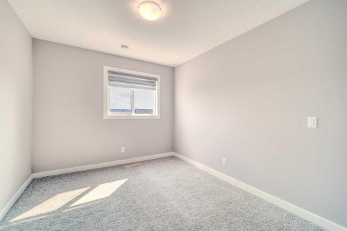 22 Sage Bluff Heights Nw, Calgary, AB - Indoor Photo Showing Other Room