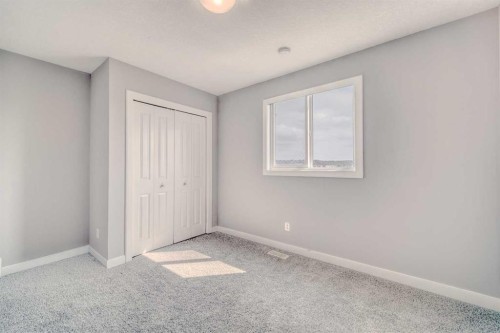 22 Sage Bluff Heights Nw, Calgary, AB - Indoor Photo Showing Other Room