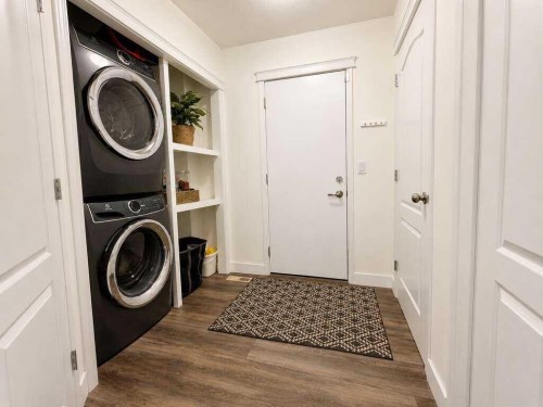 24 Brander Avenue Nw, Langdon, AB - Indoor Photo Showing Laundry Room