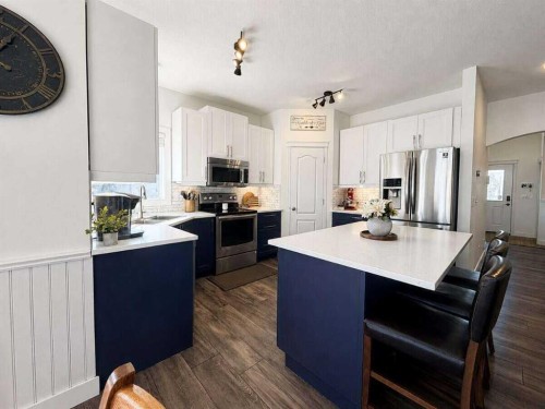 24 Brander Avenue Nw, Langdon, AB - Indoor Photo Showing Kitchen With Stainless Steel Kitchen