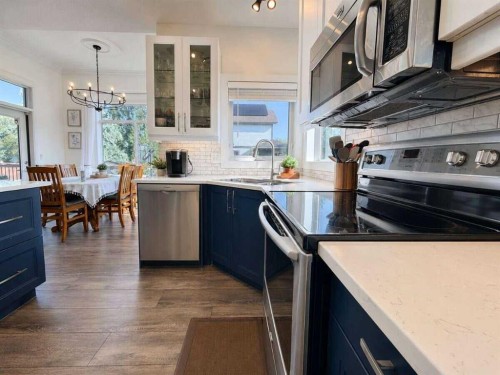 24 Brander Avenue Nw, Langdon, AB - Indoor Photo Showing Kitchen With Stainless Steel Kitchen With Upgraded Kitchen