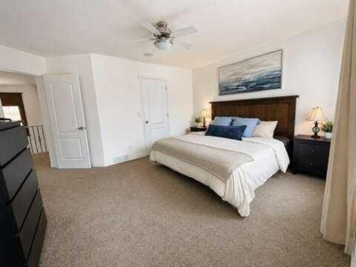 24 Brander Avenue Nw, Langdon, AB - Indoor Photo Showing Bedroom