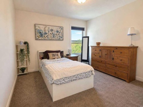 24 Brander Avenue Nw, Langdon, AB - Indoor Photo Showing Bedroom