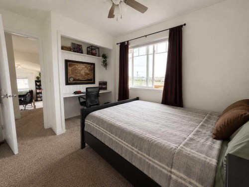 24 Brander Avenue Nw, Langdon, AB - Indoor Photo Showing Bedroom