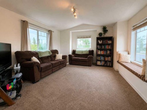 24 Brander Avenue Nw, Langdon, AB - Indoor Photo Showing Living Room