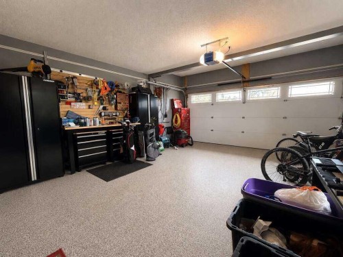 24 Brander Avenue Nw, Langdon, AB - Indoor Photo Showing Garage