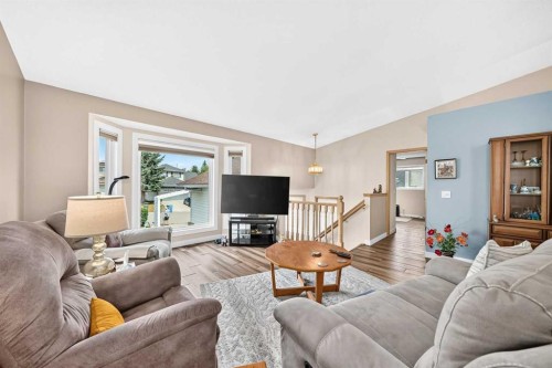 18 Shawbrooke Rise Sw, Calgary, AB - Indoor Photo Showing Living Room With Fireplace