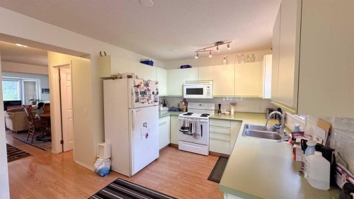 407 1 Avenue Nw, Sundre, AB - Indoor Photo Showing Kitchen With Double Sink