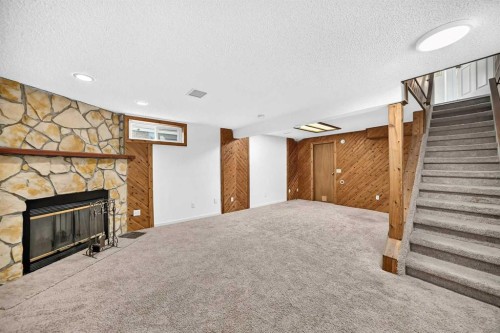 291 Falton Drive Ne, Calgary, AB - Indoor With Fireplace