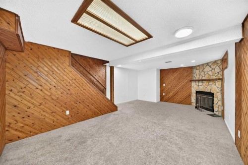 291 Falton Drive Ne, Calgary, AB - Indoor Photo Showing Other Room With Fireplace