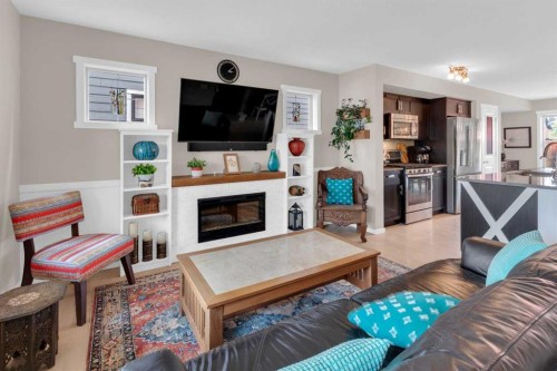 87 Marine Drive Se, Calgary, AB - Indoor Photo Showing Living Room With Fireplace