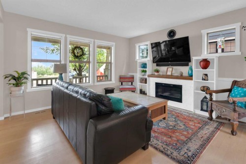87 Marine Drive Se, Calgary, AB - Indoor Photo Showing Living Room With Fireplace