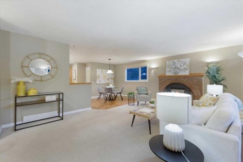 124 Oakmoor Place Sw, Calgary, AB - Indoor Photo Showing Living Room With Fireplace