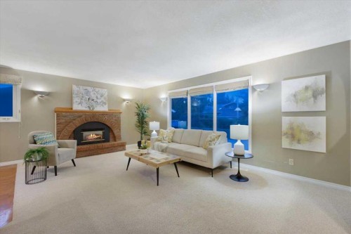 124 Oakmoor Place Sw, Calgary, AB - Indoor Photo Showing Living Room With Fireplace