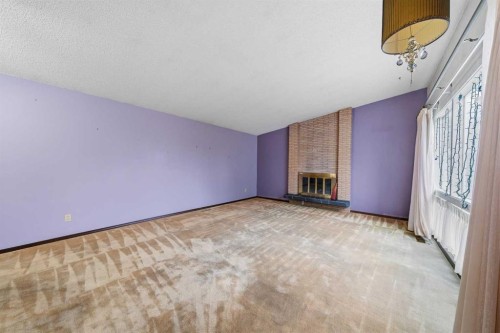 15 Glenview Drive Sw, Calgary, AB - Indoor Photo Showing Other Room With Fireplace