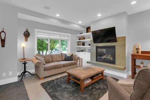 4616 82 Street Nw, Calgary, AB - Indoor Photo Showing Living Room With Fireplace